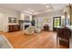 Elegant living room with hardwood floors, fireplace, recessed lighting, and stylish furnishings and decor at 2550 Ballantrae Cir, Cumming, GA 30041