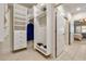 Bright walk-in closet with custom shelving, drawers, and ample storage space for clothes and shoes at 2550 Ballantrae Cir, Cumming, GA 30041