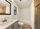 Updated bathroom features include a soaking tub, tiled floors, a modern vanity, and decorative elements at 325 Summertown Dr, Stockbridge, GA 30281