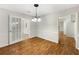 Bright dining room featuring hardwood floors and classic chandelier lighting at 325 Summertown Dr, Stockbridge, GA 30281