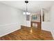 Dining area with hardwood floors open to living spaces at 325 Summertown Dr, Stockbridge, GA 30281
