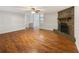 Open-concept living room featuring hardwood floors and stone fireplace at 325 Summertown Dr, Stockbridge, GA 30281
