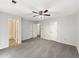 Large main bedroom with carpet, ceiling fan and ensuite access at 325 Summertown Dr, Stockbridge, GA 30281