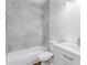 White bathroom features a shower/tub combo at 5224 W Mountain St, Stone Mountain, GA 30083