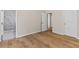 Bright bedroom with hardwood floors, ensuite bathroom and neutral paint at 5224 W Mountain St, Stone Mountain, GA 30083
