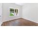 Bright bedroom with hardwood floors and large windows at 5224 W Mountain St, Stone Mountain, GA 30083