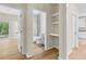 Hallway with bathroom and shelving at 5224 W Mountain St, Stone Mountain, GA 30083
