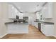 Modern kitchen featuring white cabinets, stainless steel appliances, and granite countertops at 5224 W Mountain St, Stone Mountain, GA 30083
