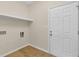 Laundry room with neutral paint and door at 5224 W Mountain St, Stone Mountain, GA 30083