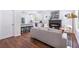 Open living space with a fireplace, flowing into a modern kitchen with stainless steel appliances at 5224 W Mountain St, Stone Mountain, GA 30083