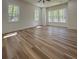 Bright, sunny bedroom with hardwood floors, large windows, and forest views at 5567 Tyree Rd, Winston, GA 30187
