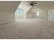 Large bonus room with carpeting, dormer windows, a modern ceiling fan, and neutral decor at 5567 Tyree Rd, Winston, GA 30187