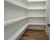 Walk-in pantry with custom shelving, offering ample storage and organization at 5567 Tyree Rd, Winston, GA 30187