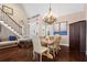 Elegant dining room featuring hardwood floors, staircase, and views of the front entrance at 6360 Spinnaker Ln, Alpharetta, GA 30005