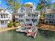 Stunning waterfront home with a private dock and boat, perfect for lake living at 6360 Spinnaker Ln, Alpharetta, GA 30005