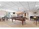 Spacious basement game room featuring a pool table and bar area for entertaining at 6360 Spinnaker Ln, Alpharetta, GA 30005