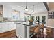 Modern kitchen with a center island, stainless steel appliances, and plenty of natural light at 6360 Spinnaker Ln, Alpharetta, GA 30005