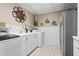 Well-equipped laundry room featuring modern appliances and ample storage space at 6360 Spinnaker Ln, Alpharetta, GA 30005