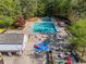 Aerial view of a community pool featuring lap lanes, a kiddie pool, and plenty of seating at 6360 Spinnaker Ln, Alpharetta, GA 30005