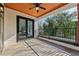 Outdoor balcony featuring an indoor/outdoor flow with a beautiful backyard view and ceiling fan for those warm nights at 1140 Hubbard Sw St, Atlanta, GA 30310