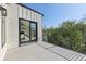 Exterior balcony features iron railing, with French door access to the main bedroom at 1140 Hubbard Sw St, Atlanta, GA 30310