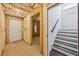 View of unfinished basement leading to carpeted stairs at 1140 Hubbard Sw St, Atlanta, GA 30310