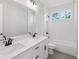 Bathroom featuring double sinks, a large mirror, and a shower/tub combo at 1140 Hubbard Sw St, Atlanta, GA 30310