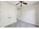 Neutral bedroom featuring carpeted floors, a ceiling fan, and a closet at 1140 Hubbard Sw St, Atlanta, GA 30310