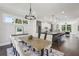 Bright dining area showcasing an open floor plan with stylish decor, seamlessly connecting to the kitchen and living spaces at 1140 Hubbard Sw St, Atlanta, GA 30310