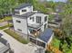 Modern home features balconies, large windows, metal roof, and attached two-car garage at 1140 Hubbard Sw St, Atlanta, GA 30310