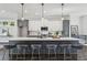 Kitchen featuring a large island with seating, pendant lighting, and modern appliances at 1140 Hubbard Sw St, Atlanta, GA 30310