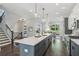 Open kitchen with a large island, modern appliances, and easy access to dining and stairs at 1140 Hubbard Sw St, Atlanta, GA 30310