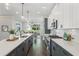 Modern kitchen with stainless steel appliances, a large island, and hardwood floors at 1140 Hubbard Sw St, Atlanta, GA 30310