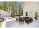 Backyard patio with outdoor seating, hot tub, and a serene wooded backdrop for outdoor living at 1931 Mceachern Manor Sw Dr, Marietta, GA 30064