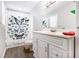 Bathroom with a butterfly shower curtain, a window, and updated vanity at 1931 Mceachern Manor Sw Dr, Marietta, GA 30064