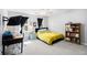 Bedroom with a bed, workspace, bookshelf, a large window, and neutral walls at 1931 Mceachern Manor Sw Dr, Marietta, GA 30064