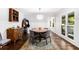 Bright dining room with a hardwood floors next to a bright window at 1931 Mceachern Manor Sw Dr, Marietta, GA 30064