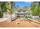 Charming two-story home with a welcoming front porch and a well-manicured lawn at 1931 Mceachern Manor Sw Dr, Marietta, GA 30064