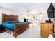 Spacious main bedroom features a wooden bed, bright natural light, and ample closet space at 1931 Mceachern Manor Sw Dr, Marietta, GA 30064
