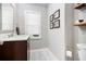 Charming powder room featuring modern fixtures, vanity with storage, and neutral tones at 1931 Mceachern Manor Sw Dr, Marietta, GA 30064