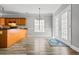 Open kitchen with stainless appliances, wood cabinets, and a view to the backyard at 206 Cole Ct, Canton, GA 30114