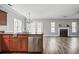 Open-concept floor plan connecting the kitchen to a spacious living room with a fireplace at 206 Cole Ct, Canton, GA 30114
