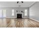 Spacious living room featuring a fireplace, hardwood floors, and access to the outdoors at 206 Cole Ct, Canton, GA 30114