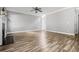 Large living room with hardwood floors, neutral paint, and plenty of space for furniture at 206 Cole Ct, Canton, GA 30114