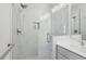 Modern bathroom featuring a glass walk-in shower with white marble herringbone tiling and modern fixtures at 2424 Lakeshore Se Ln, Atlanta, GA 30316
