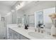 Bright bathroom with dual sinks, a walk-in shower and neutral finishes at 2424 Lakeshore Se Ln, Atlanta, GA 30316