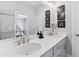 Elegant bathroom with dual sinks, neutral walls, and a walk-in shower at 2424 Lakeshore Se Ln, Atlanta, GA 30316