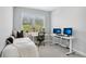 Cozy bedroom with daybed, large window, and white desk for an organized work-from-home space at 2424 Lakeshore Se Ln, Atlanta, GA 30316