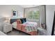 Comfortable bedroom featuring a plush rug, full bed, and bright window at 2424 Lakeshore Se Ln, Atlanta, GA 30316