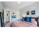Bedroom with serene interior design featuring a full bed and gray walls at 2424 Lakeshore Se Ln, Atlanta, GA 30316